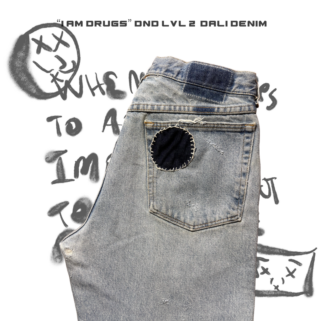 Denim pants with a dark blue denim patch on a white background with text and graphics.